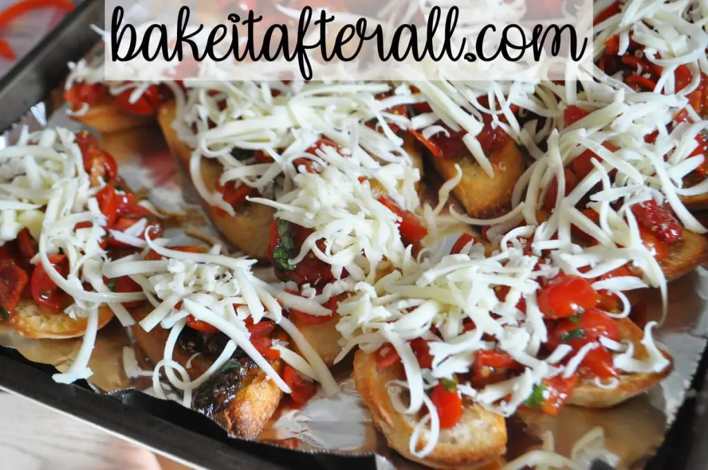 slices of bread topped with tomato mixture and shredded cheese on top before baking