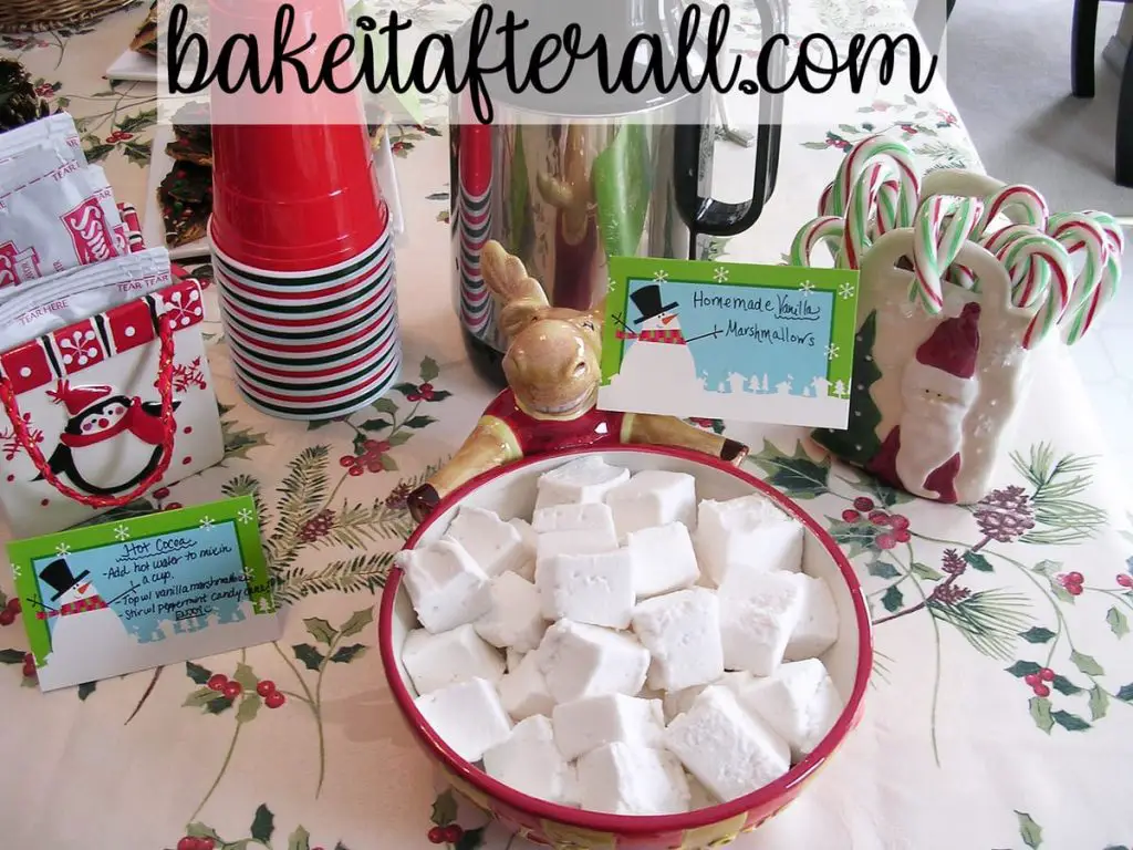 hot chocolate station featuring packets of hot cocoa, homemade marshmallows and candy canes for a Holiday Open House