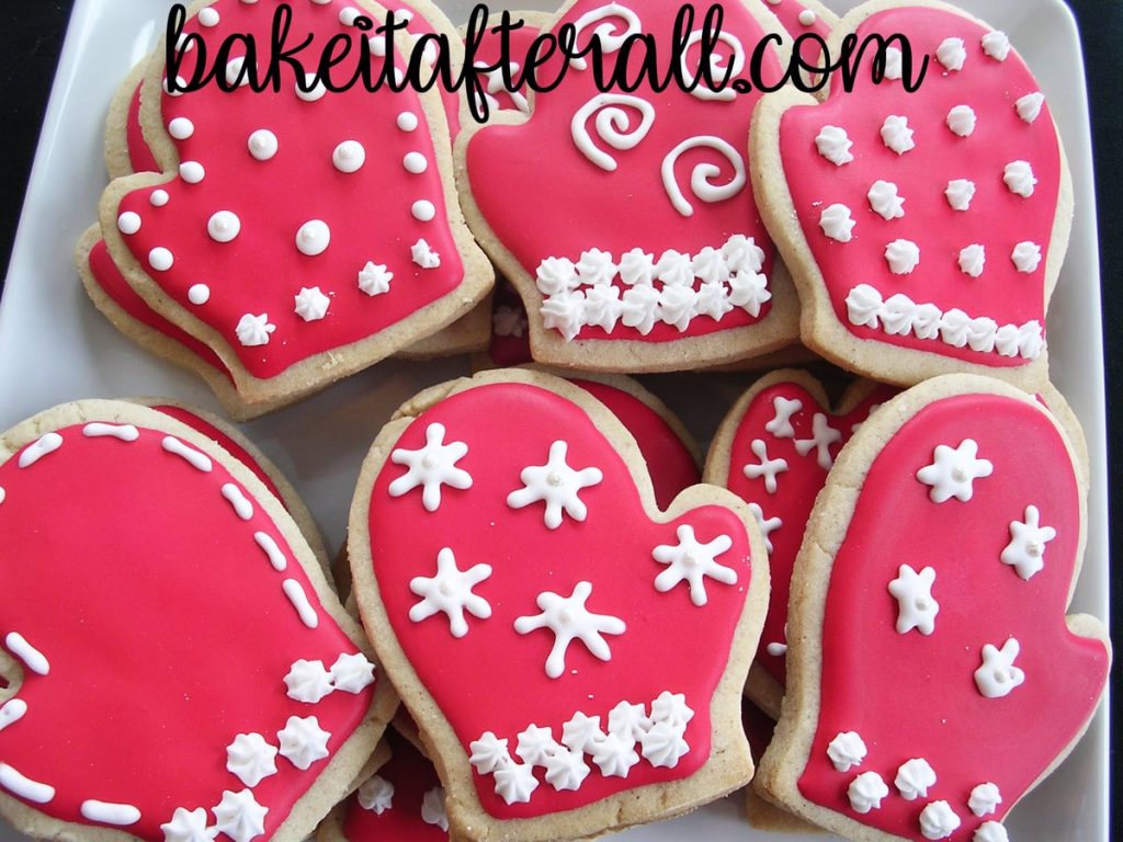 Brown Sugar and Spice Cookies shaped as mittens decorated with snowflake designs