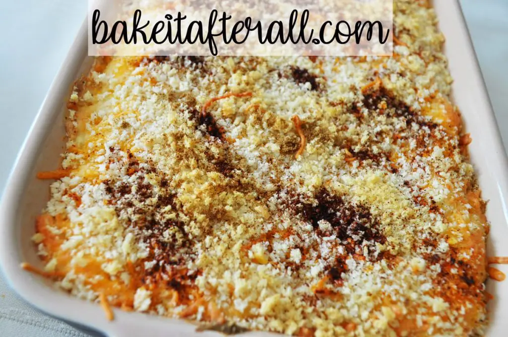 dish of dip baked with panko bread crumbs on top