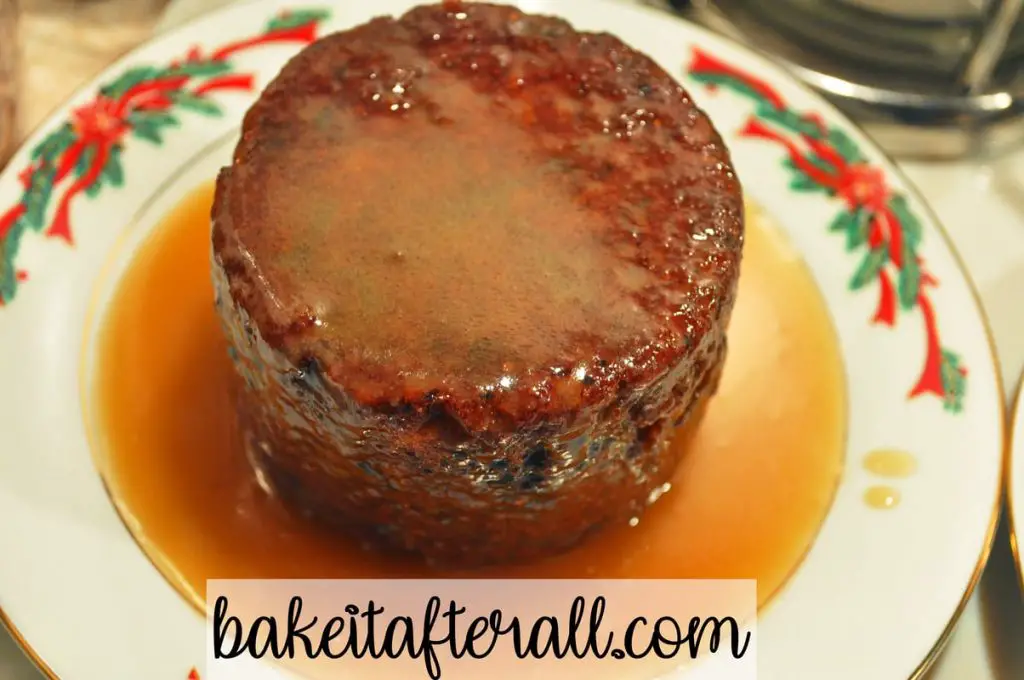 unmolded cake on a plate with caramel sauce on top
