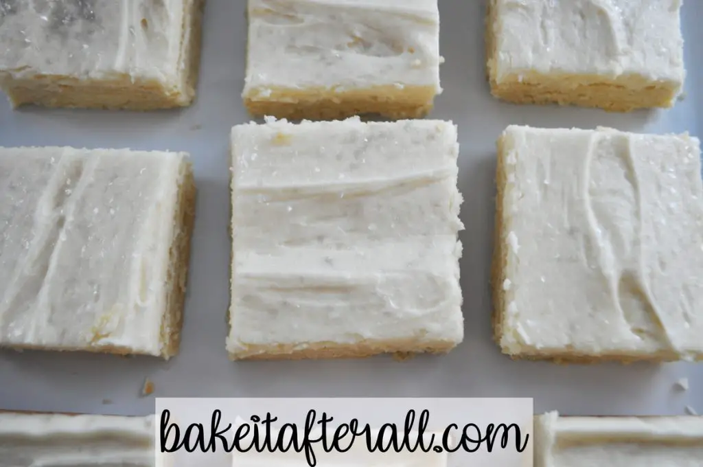 sugar cookie bars on a white plate