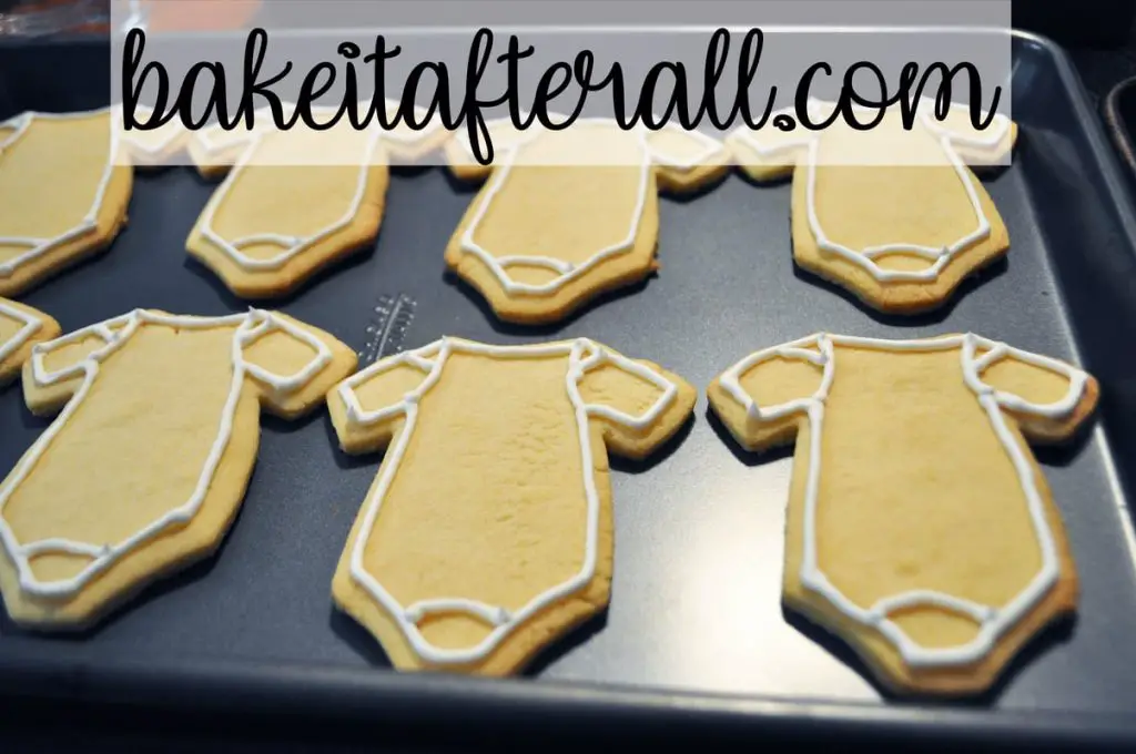 onesie cookies outlined with toothpaste consistency royal icing 