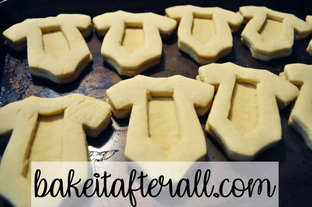 sugar cookie middles on top of bottoms to reveal an open cavity ready to be filled