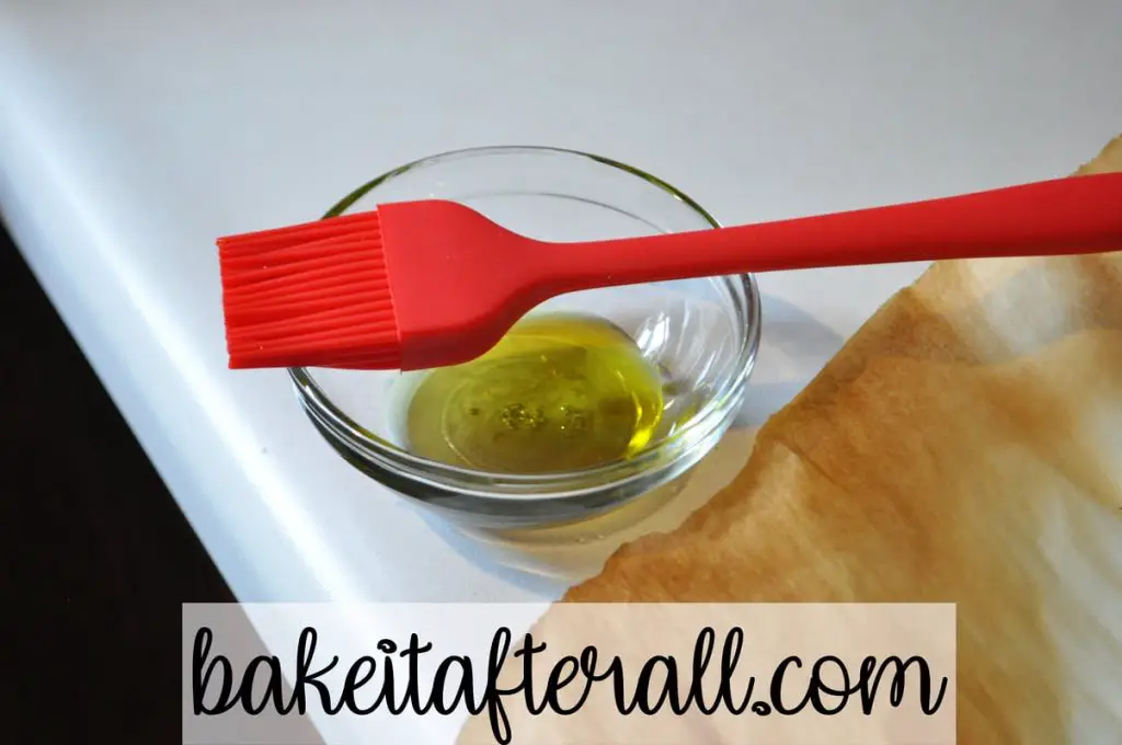 olive oil and silicone pastry brush for brushing on pizza dough