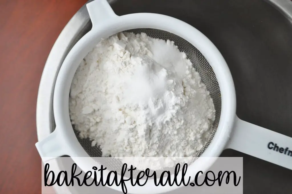 flour, salt, and baking powder in a small wire strainer