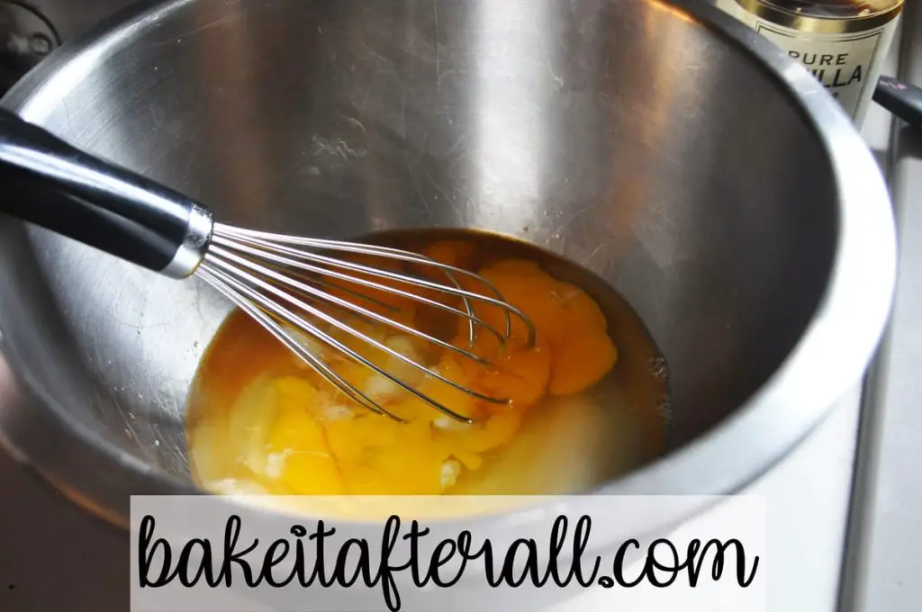 whisking eggs with vanilla and sugar