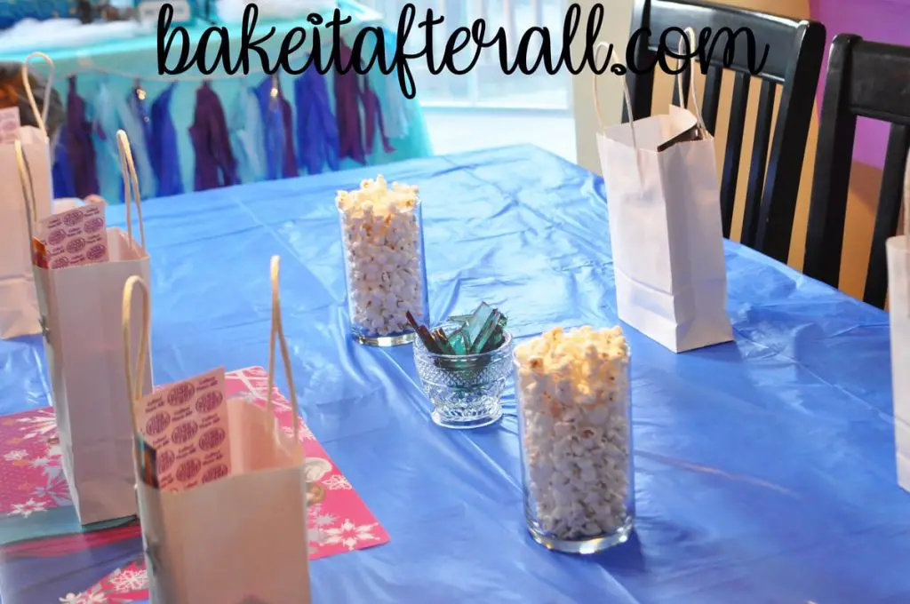 white popcorn and Elsa's ice candy on kids table