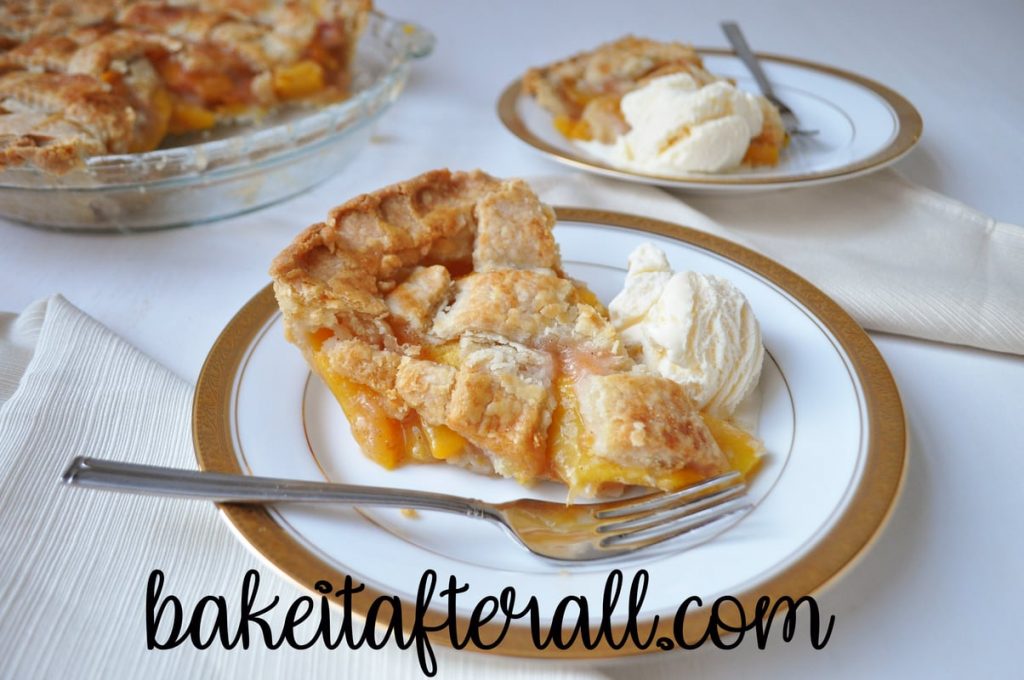 peach pie with ice cream on a plate with fork
