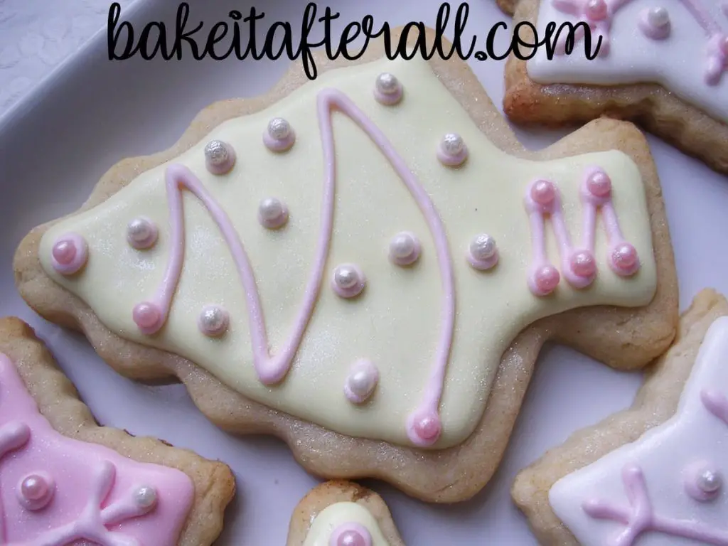 pastel Christmas tree sugar cookie decorated with royal icing and sugar pearls