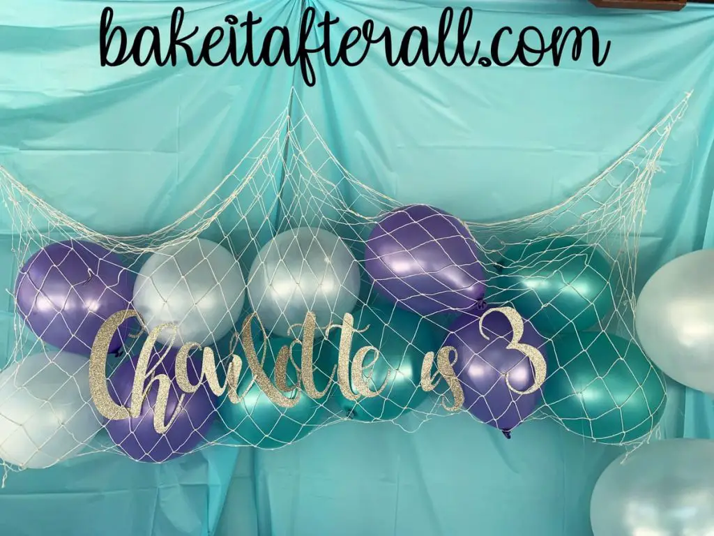 under the sea birthday party balloons in a fish net