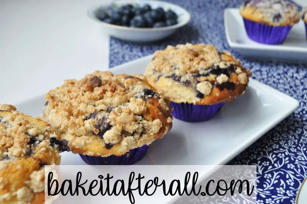 streusel topped muffins on a white platter