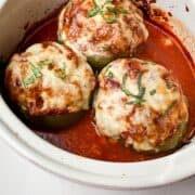 Italian Stuffed Green Peppers in a white casserole dish