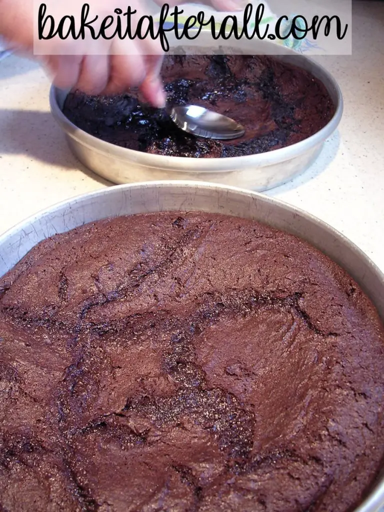 crust being pushed down with a spoon