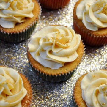tres leches cupcakes on a sparkly gold platter