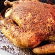 spicy roasted chicken in a roasting pan