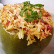 a green pepper stuffed with orzo mixture on a plate
