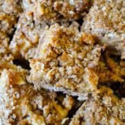 caramel apple bars stacked on a silver tray