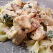 creamy chicken with bowtie pasta on a plate