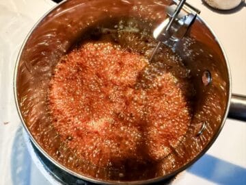 pumpkin seed brittle bubbling in a saucepan