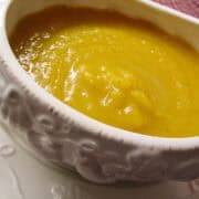 butternut squash and apple soup in a bowl