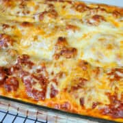turkey lasagna baked in a glass dish on a cooling rack