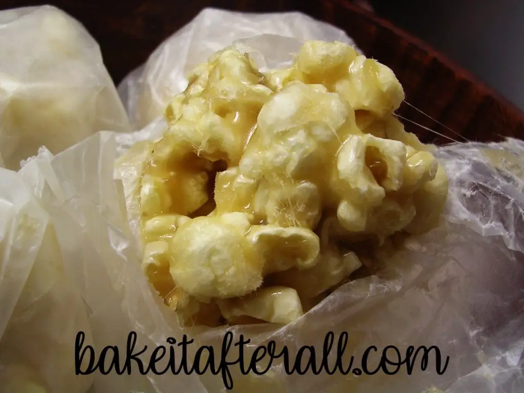 Caramel Popcorn Balls wrapped in wax paper close up