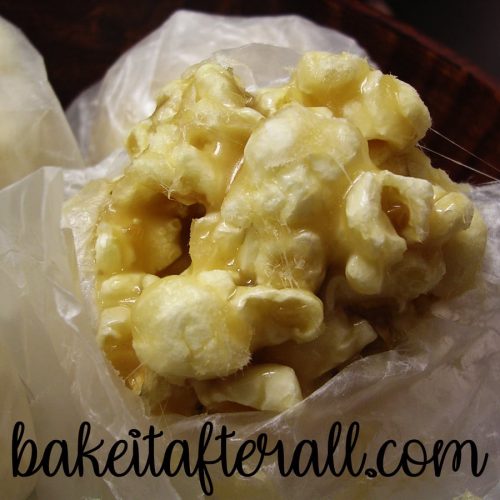 Caramel Popcorn Balls wrapped in wax paper close up
