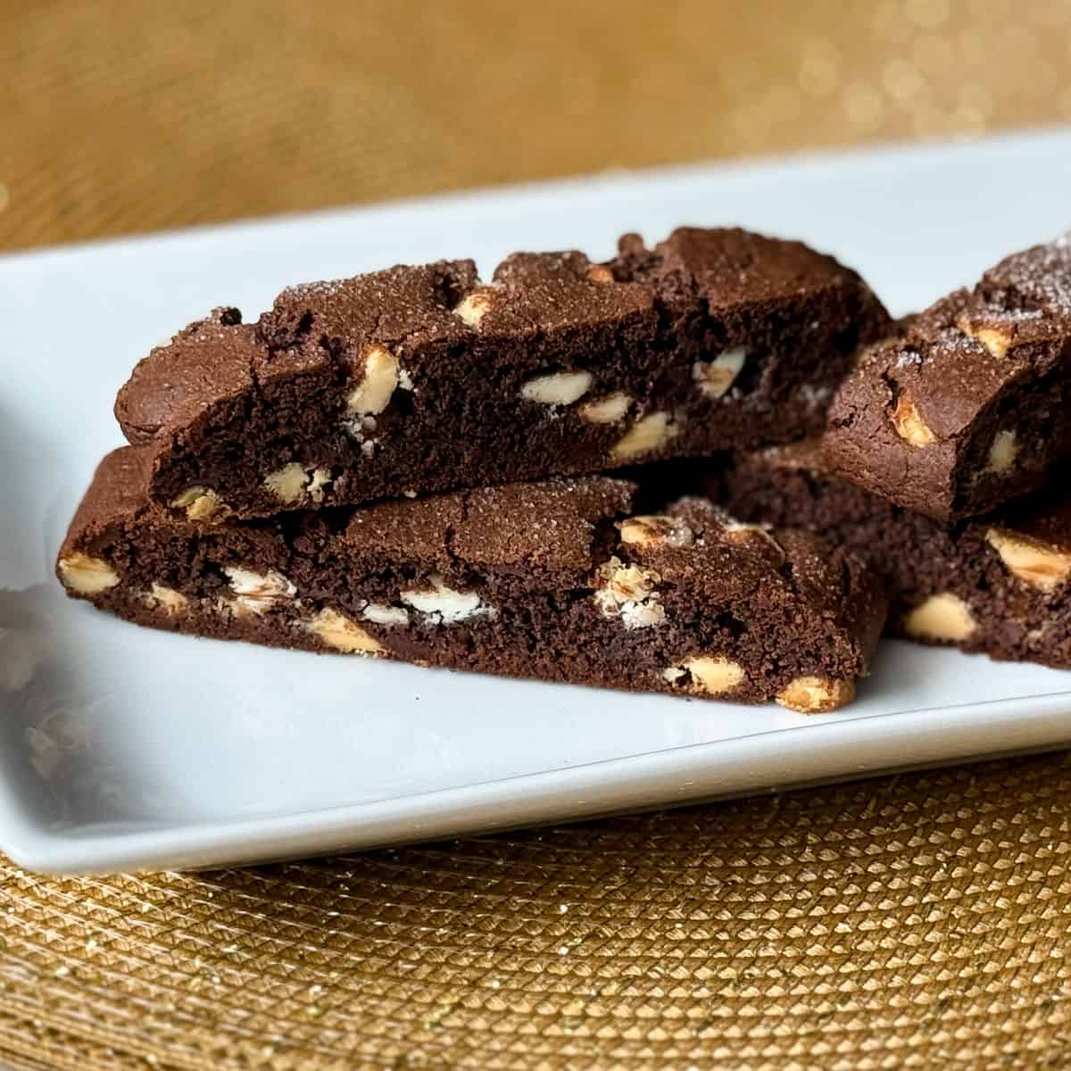 a white plate filled with Nut Free Triple Chocolate Biscotti
