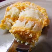 mashed potato layered casserole on a fork to show the layers