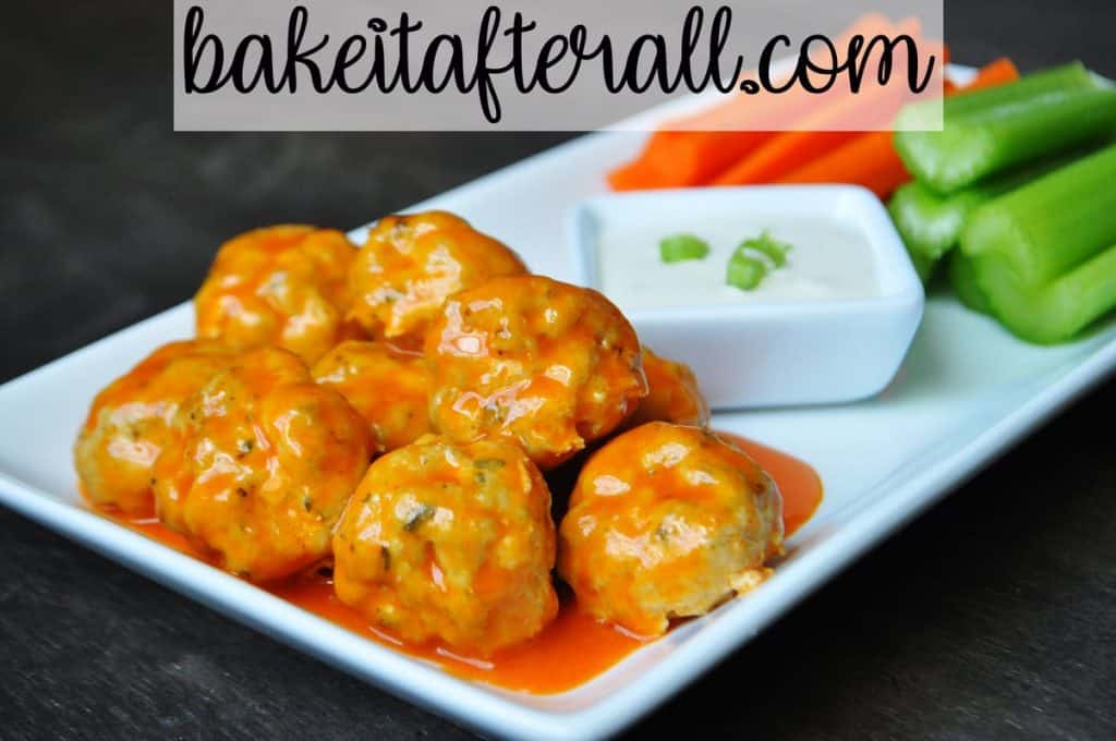 Buffalo Chicken Meatballs with dressing and carrots and celery sticks