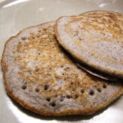 blue cornmeal pancakes on a plate