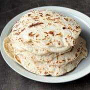 a pile of soft wrap breads on a plate