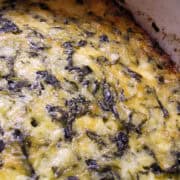 a spinach souffle in a white dish