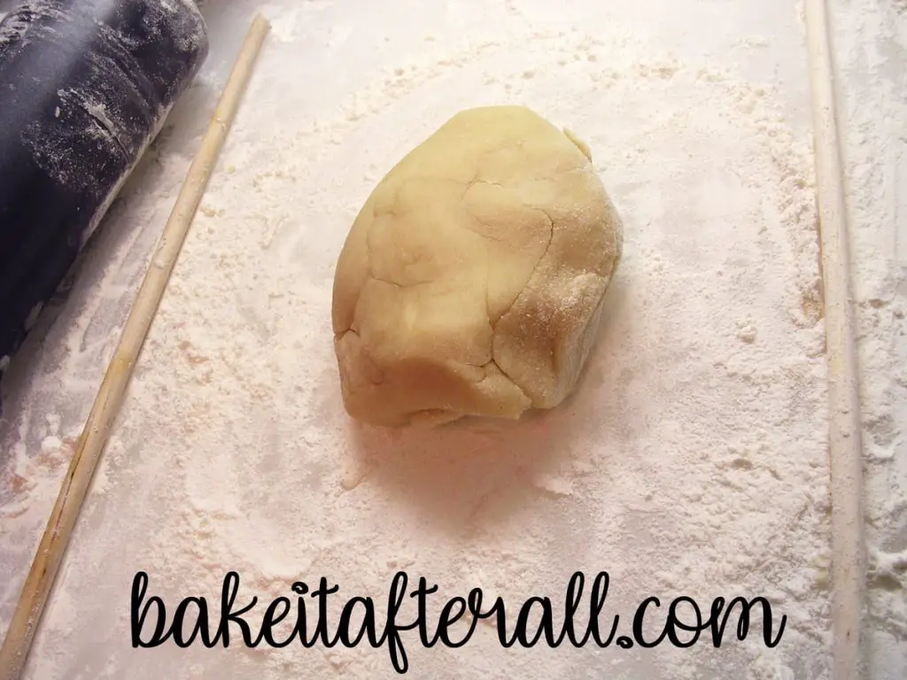 sugar cookie dough on a floured cutting board
