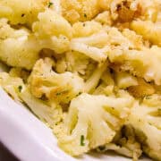 Garlic Roasted Cauliflower in a white pie plate