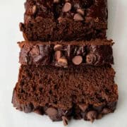Chocolate Banana Bread sliced on a white surface