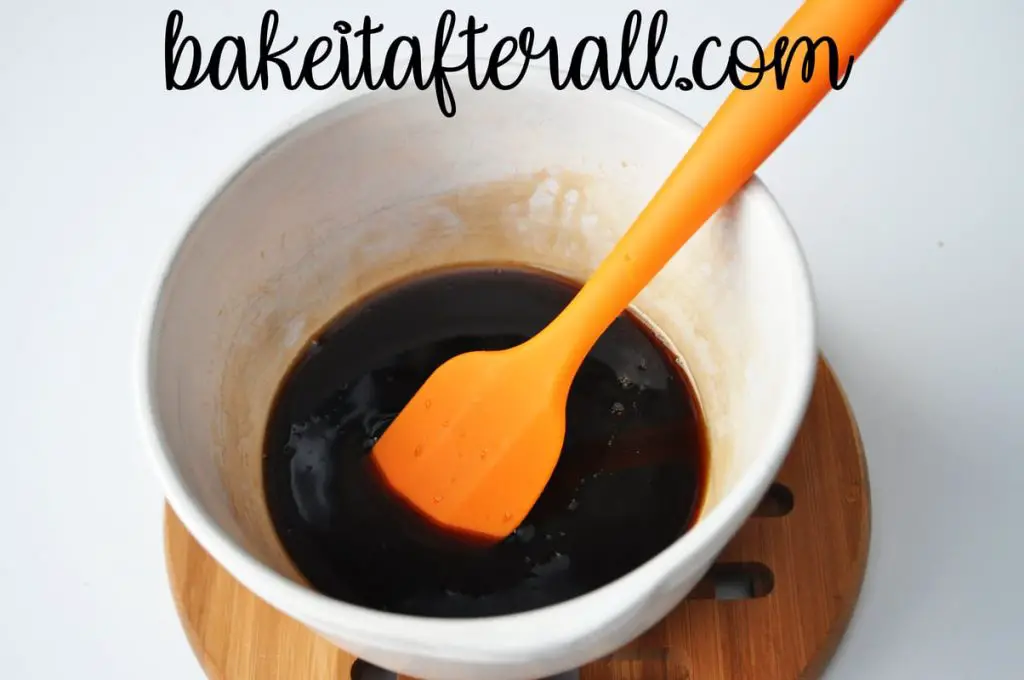 honey balsamic vinegar glaze in a bowl with a small silicone spatula