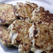 breakfast chicken sausage patties stacked on a plate