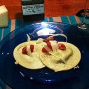 a plate with mushroom and mascarpone ravioli on it