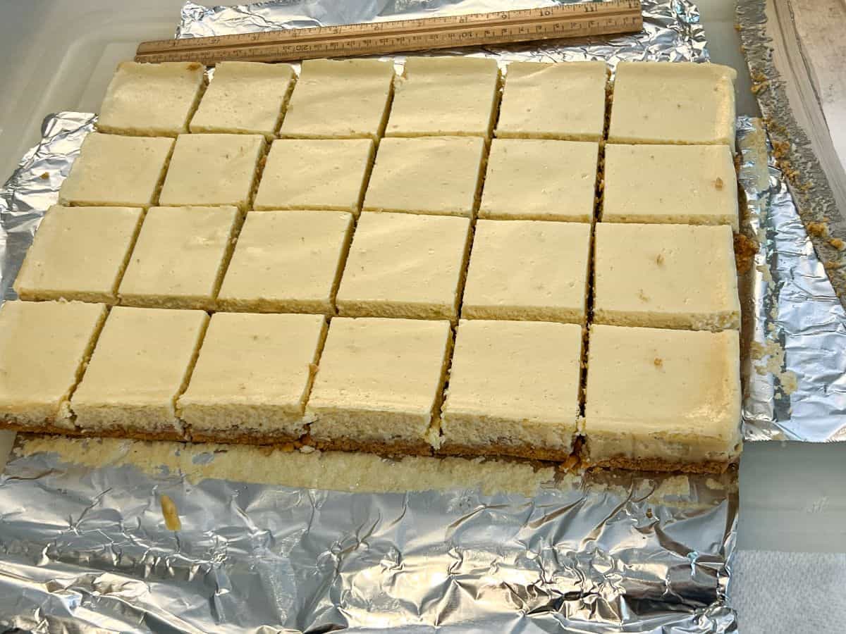 a pan of key lime bars cut into 24 squares