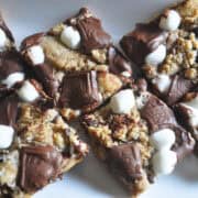 Graham cracker s'mores cookie bars on a white plate