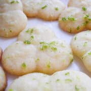 Lime glazed butter cookies on a white plate