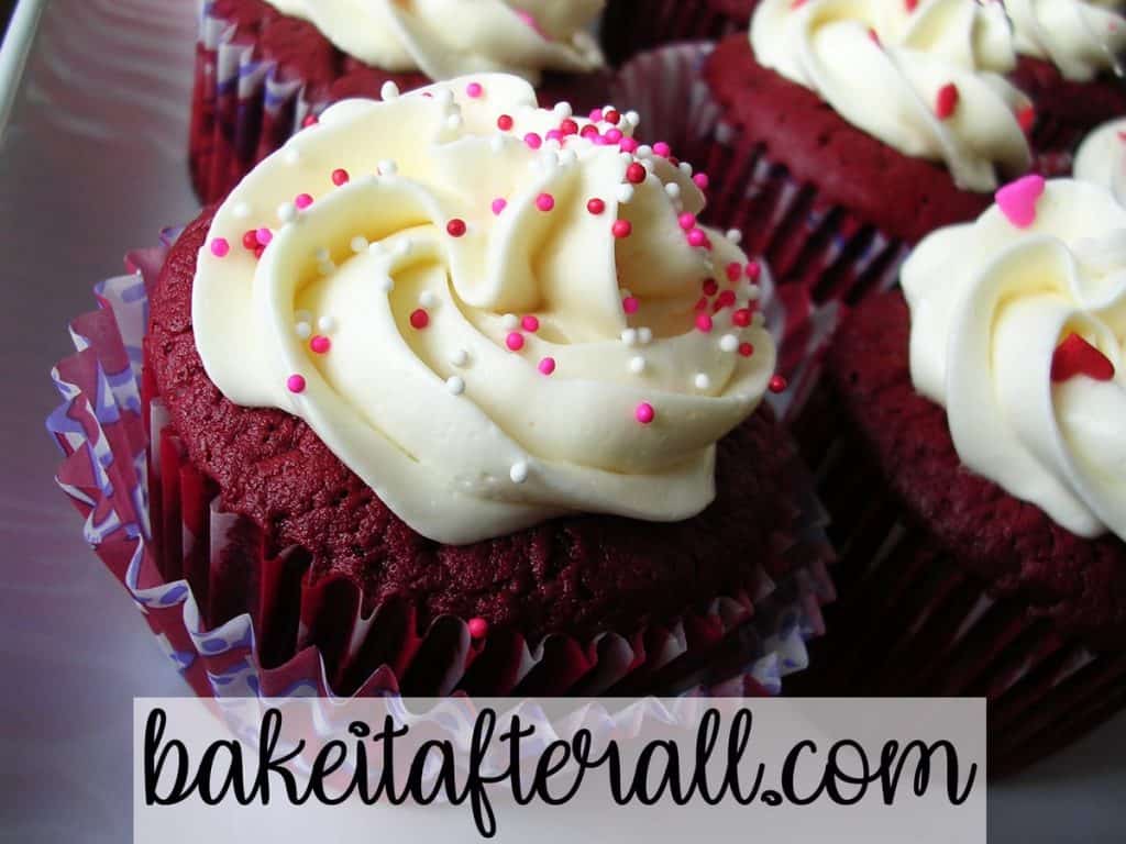 Vanilla Swiss Meringue Buttercream on red velvet cupcakes with Valentine's sprinkles