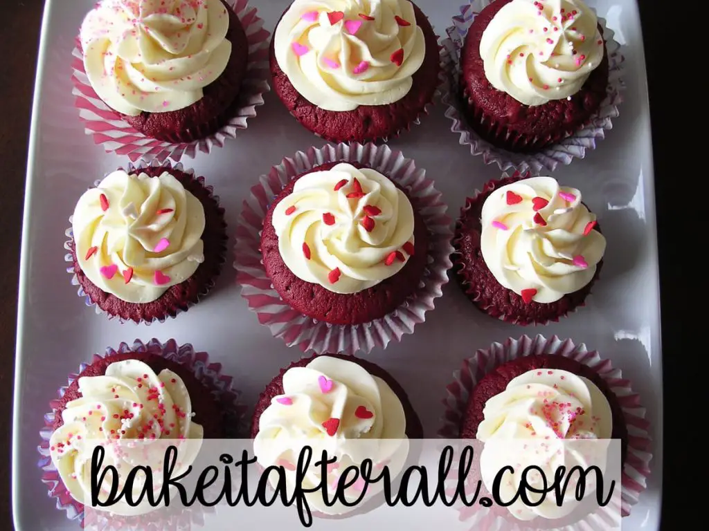 Vanilla Swiss Meringue Buttercream on red velvet cupcakes with Valentine's sprinkles