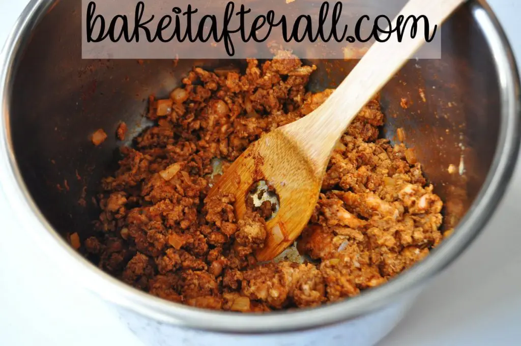 Instant Pot Ground Turkey Tacos in bowl of instant pot with wooden spoon