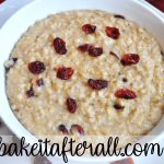 Steel Cut Oatmeal in a bowl with dried cranberries on top