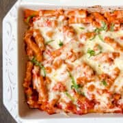 a baking dish filled with baked ziti sorrentino