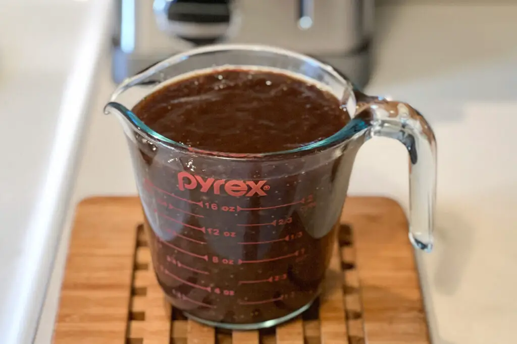 fig and date puree in a glass measuring cup