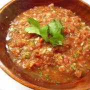 a wooden bowl filled with fresh homemade salsa